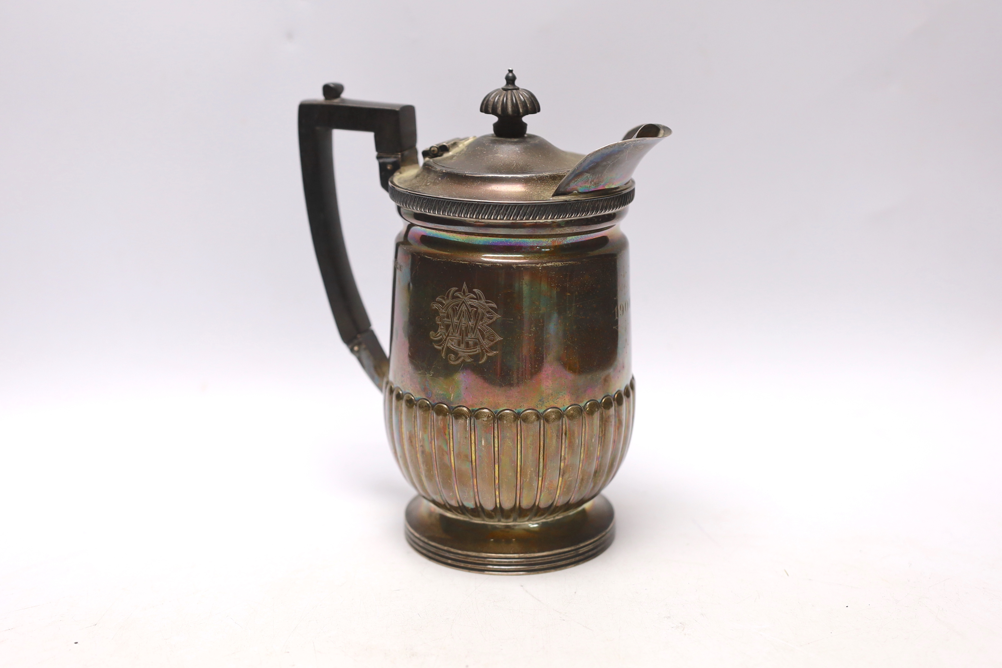 A late Victorian demi-fluted silver hot water jug, Mappin & Webb, Sheffield, 1897, gross weight 17.6oz.
